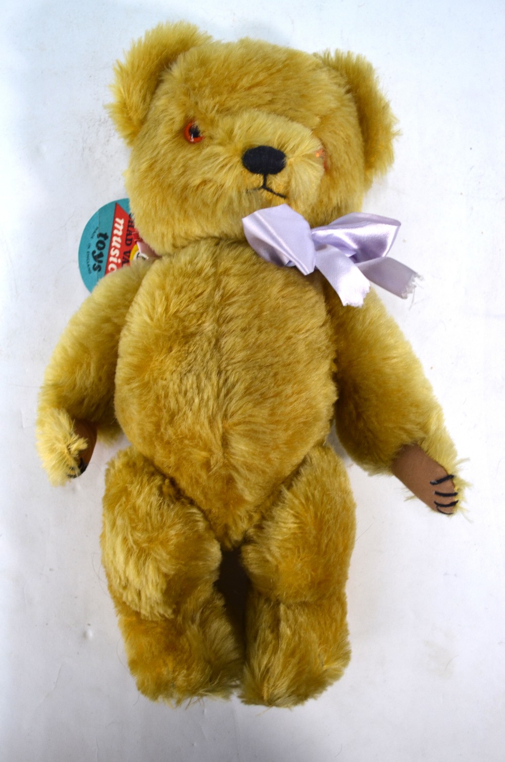 A Chad Valley gold plush teddy bear with musical movement, 37 cm ...