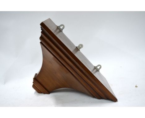 A heavy mahogany clock bracket. 43 w x 31 h x 27 depth