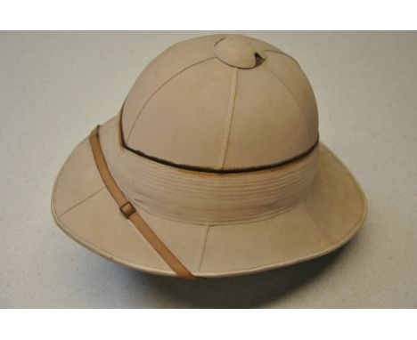 A vintage pith helmet retailed by Gieves Royal Naval Outfitters, 21 Old Bond St., London W, three German caps, a leather pouc