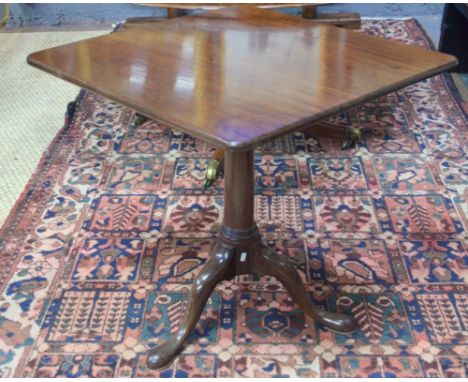 A 19th century mahogany tilt top tripod table, the square top raised on a turned pillar to pad feet, 67 x 67 x 70 cm high