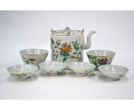 A Chinese famille rose part-service comprising: a teapot and cover; two bowls and four covers; the teapot 13 cm high, each pi