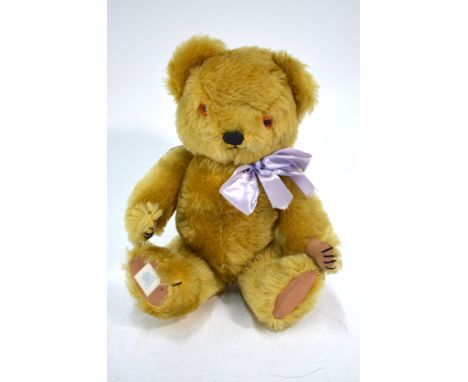 A Chad Valley gold plush teddy bear with musical movement, 37 cm   Condition Report  Slightly dusty smellGood condition