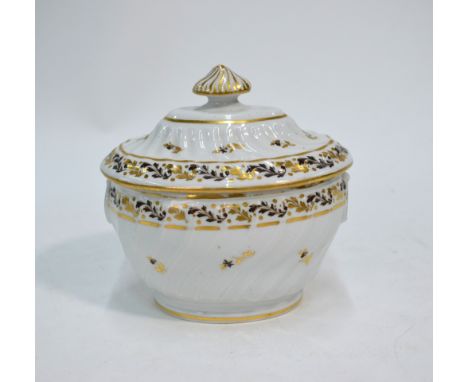 An 18th century Chamberlain's oval sugar box and cover of moulded writhen form, decorated with a black and gilt foliate borde