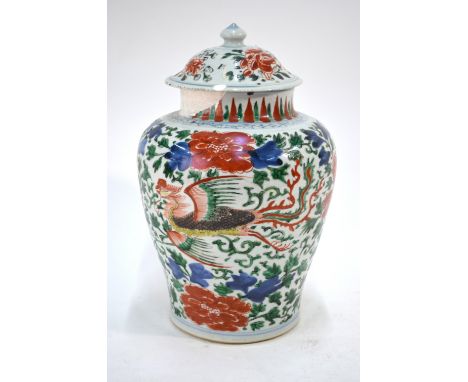 A Chinese Wucai oviform vase with unglazed base, associated domed cover and knop finial, decorated in underglaze blue and typ