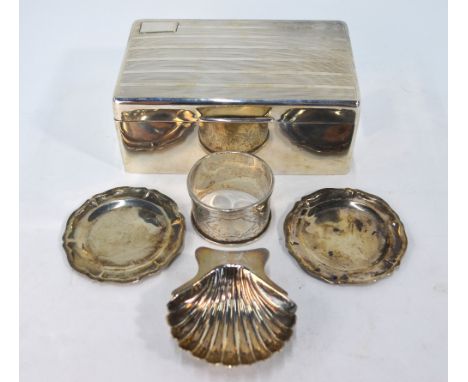 An engine-turned silver cigarette box with cedar lining, Birmingham 1929, to/w an engraved silver napkin ring, two miniature 