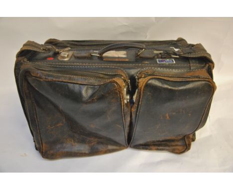 A vintage gentleman's leather flight holdall with British Airways and other labels, with hangers to interior Condition Report