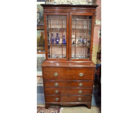 A Victorian mahogany secretaire bookcase, having two astragal glazed doors over a fitted drawer and three long graduated draw