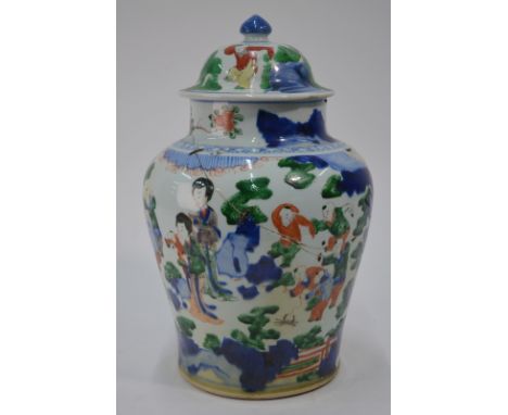 A Chinese Wucai oviform vase with domed cover and knop finial; decorated in typical underglaze blue and colours with four lad