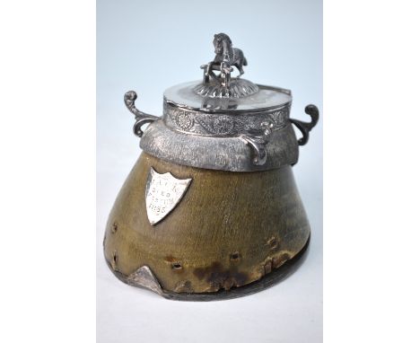 A Victorian horse's hoof inkwell with electroplated mounts, the hinged cover with jumping horse finial, the shield engraved '
