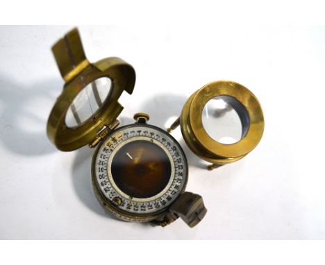 An Edwardian Army & Navy Co-operative Society gilt pocket barometer with silvered dial, in leather case incorporating a mercu