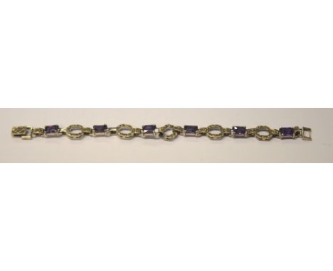 An Art Deco style amethyst and marcasite linked bracelet with concealed marcasite snap, silver set