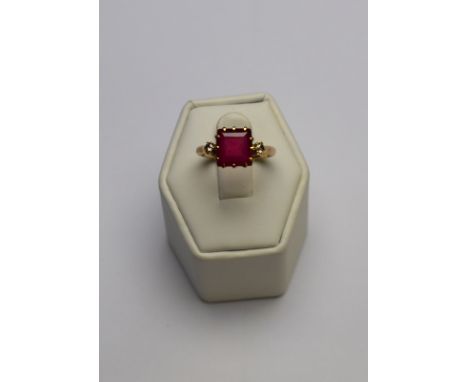 An oval ruby and eight cut diamond cluster ring, 9ct yellow and white gold setting to/w square cut synthetic ruby having smal