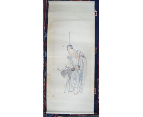 A Chinese scroll picture of The Daoist, Shoulao standing beside a Deer, a Lady and two young children; single-line inscriptio