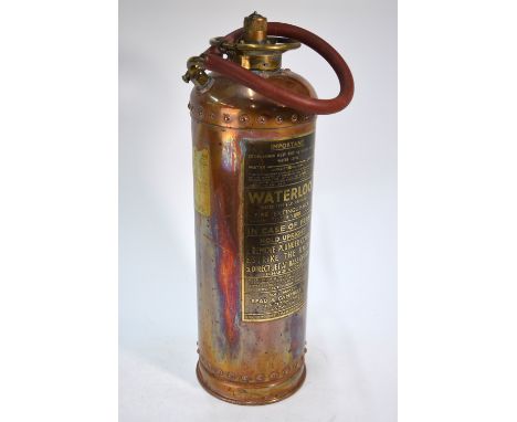 A vintage riveted copper Waterloo Fire Extinguisher, Type BD2, by Read & Campbell Ltd., Victoria St., SW1