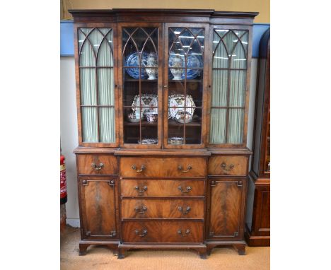 A diminutive Victorian style mahogany breakfront library secretaire bookcase with astragal glazed doors over a fitted secreta