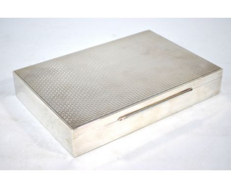 A Sterling cigar box with brick-effect engine turning, 22 cm wide