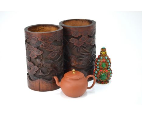 A Chinese pair of cylindrical bamboo bitong, each one decorated with dragons, 18 cm high; together with a small Yixing teapot