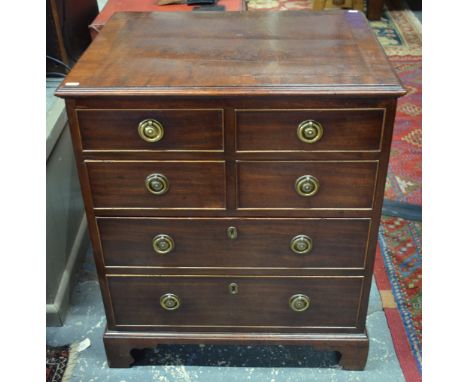 A 19th century diminutive mahogany chest of two short over two long graduated drawers, raised on shaped bracket feet, convert