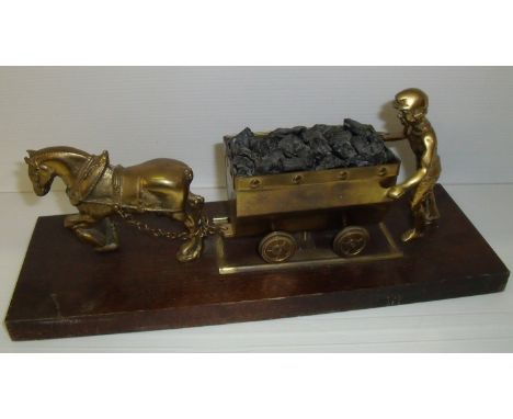 Brass model of a horse drawn mining wagon on wooden plinth