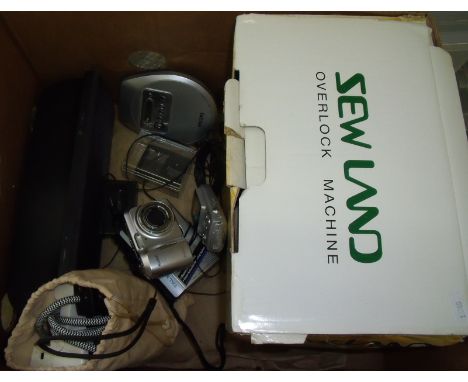 Sewland over locking machine, Sanjo Walkman, Kodak instamatic camera, docking station  etc.