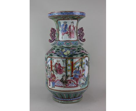 A Chinese famille rose porcelain two handled vase, decorated with panels of figures within borders of birds, flowers and frui