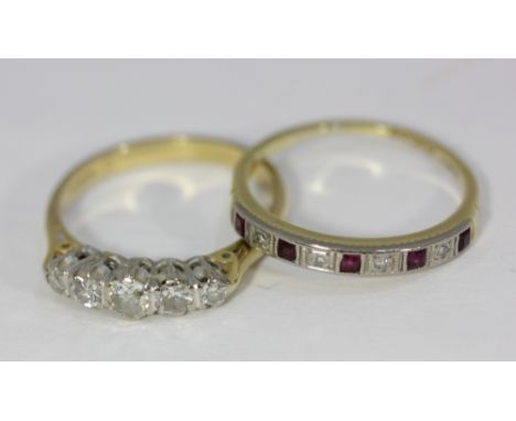 A five stone diamond ring, set with five graduated round cut diamonds, (a/f) and a diamond and ruby half hoop eternity band, 