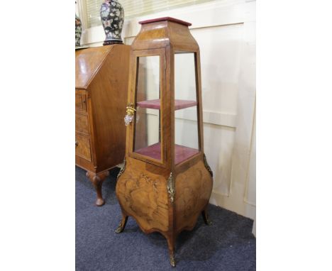 A Louis XV style inlaid and gilt metal mounted display cabinet with velvet lined shelf above glazed panel door enclosing shel