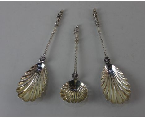 A pair of Edward VII silver serving spoons shell shaped bowls and cast handles with figural terminal, maker Wm Hutton,London 