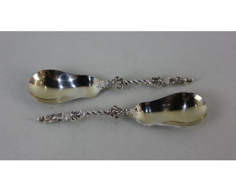 A pair of Edward VI silver apostle serving spoons pear shaped bowls entwined stems and apostle terminal, maker Wm Hutton,Lond