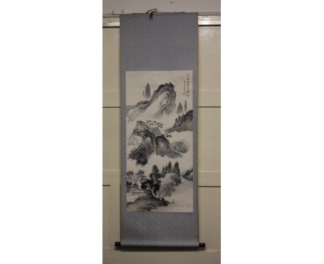 A Chinese scroll decorated with a mountainous landscape, top right with calligraphy and red seal, picture area 96.5cm by 46cm