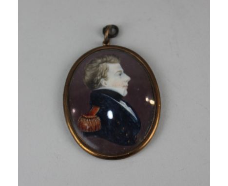 A 19th century oval head and shoulders miniature portrait profile of a Navy officer verso later paper label printed 'William 