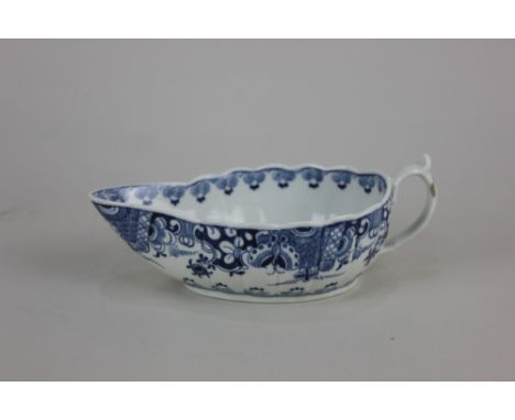 A Worcester porcelain 'Doughnut Tree' pattern blue and white sauce boat, of fluted form, the exterior with Oriental border, 1