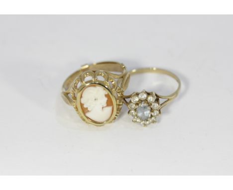 An aquamarine cluster ring in 9ct gold set with white stones and a gold modern cameo style ring in 9ct gold, gross weight 5.4
