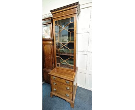 An Edwardian mahogany crossbanded and inlaid narrow display cabinet, with panel door enclosing three adjustable shelves, the 