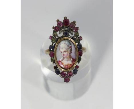 A Georgian giardinetti ring with portrait miniature, set with rubies, sapphires, emeralds and diamonds, all in gold with a cl