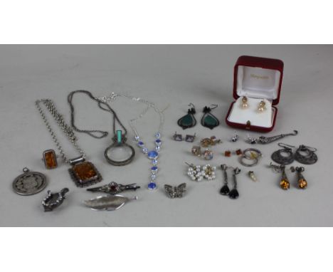 A collection of silver and white metal jewellery to include an amber pendant on a silver chain and an amber ring