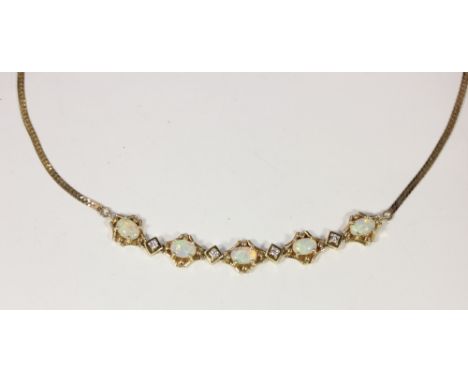 An opal and diamond necklet in 14ct gold, set with five oval cabochon opals in a four claw setting, with a brilliant cut diam