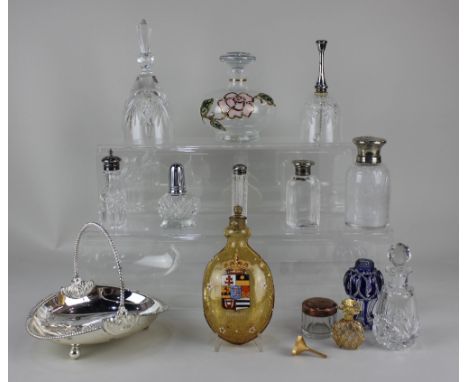 A small collection of glass scent bottles, some metal mounted, together with an amber glass flask decorated with the Homburg 