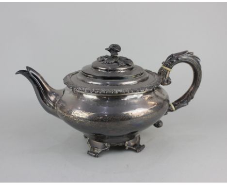 A George III silver teapot circular shape with dome lid and floral cast finial and scroll handle, maker Charles Price, London