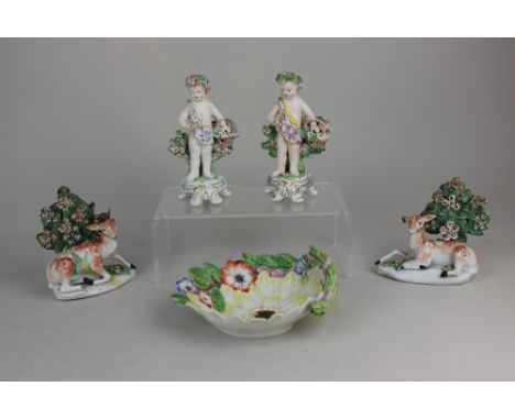 An 18th century Chelsea porcelain flower shaped dish, 15.5cm, together with a pair of Derby porcelain models of recumbent dee