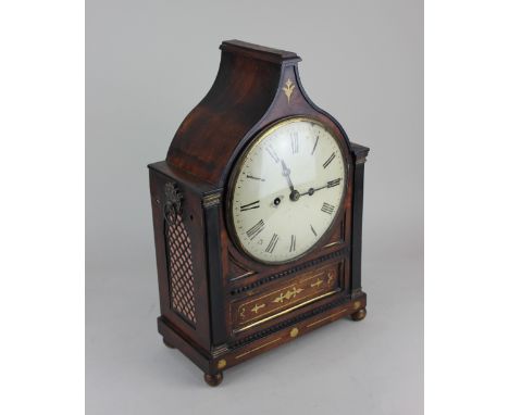 A Regency mahogany and brass inlaid bracket clock the cream enamelled dial with Roman numerals, striking on a bell,  the case