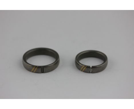 A pair of Titanium wedding rings, one diamond set, stamped 'Desiree'