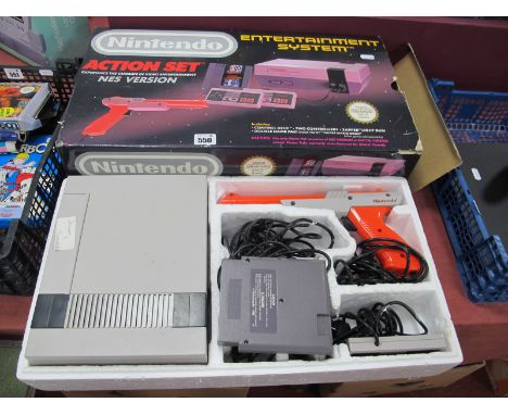 A Boxed Nintendo Entertainment System (NES) Gaming Console, box contents, include control deck, two controllers, zapper light