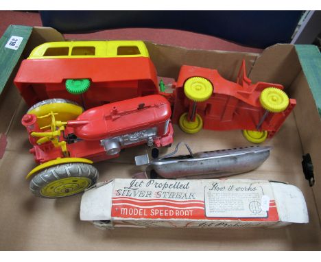 A Combination Tinplate/Plastic Battery Operated Reversible Tractor Toy, plastic Willy's Jeep and Caravan, a boxed jet propell