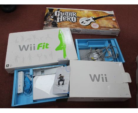 Three Boxed Nintendo WII Items, comprising of a gaming console, WII fit balance board, guitar hero wireless Les Paul controll