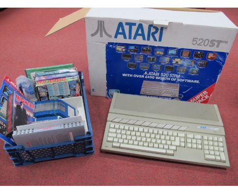 A Circa 1988 Atari 520ST Home Computer, owners manual and associated literature, floppy disk format games, include Eddie Edwa
