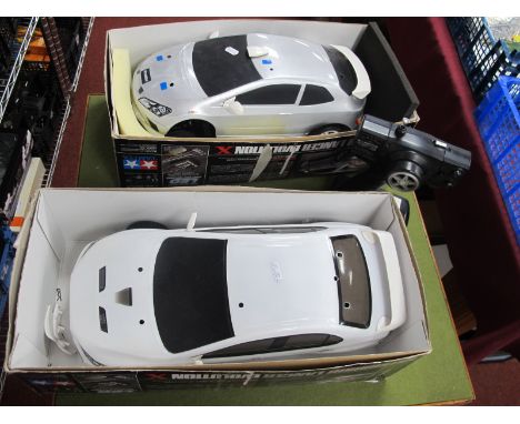 Two Tamiya 1/10th Scale R/C Mitsubishi Lancer Evo Cars, one with controller; both playworn,components not checked for complet