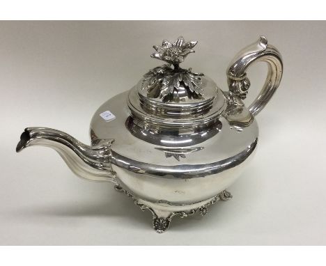 An attractive Georgian style silver melon shaped teapot with rose finial to scroll feet. London. By Barnards. Approx. 622 gra