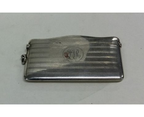 A large engine turned silver card case with hinged top. Birmingham. By AC. Approx. 52 grams. Est. £30 - £40.