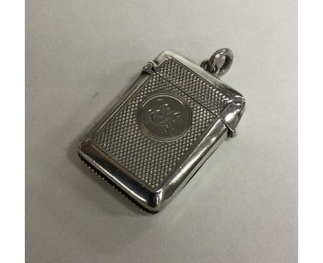 An engine turned silver vesta case. Birmingham. Approx. 15 grams. Est. £15 - £20.